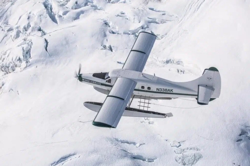 A Wings Airways de Havilland Otter seaplane flying above the Juneau Icefield in Southeast Alaska.